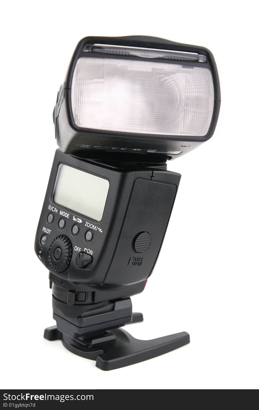 Modern flashlight on a support, isolated on a white background