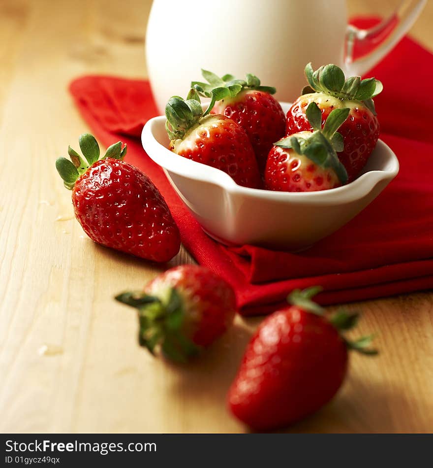 Fresh strawbeeries in a bowl and yogurt. Fresh strawbeeries in a bowl and yogurt