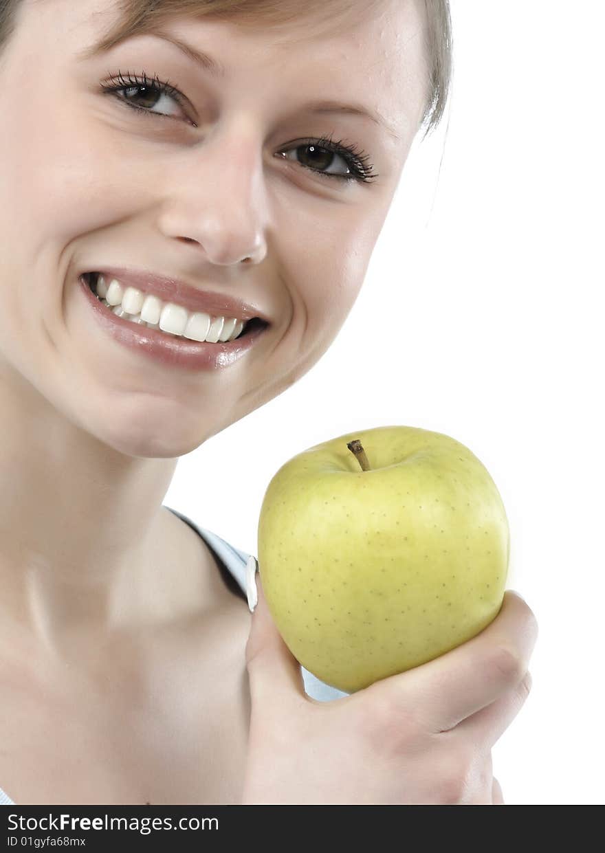 Beautiful young woman holding a green apple