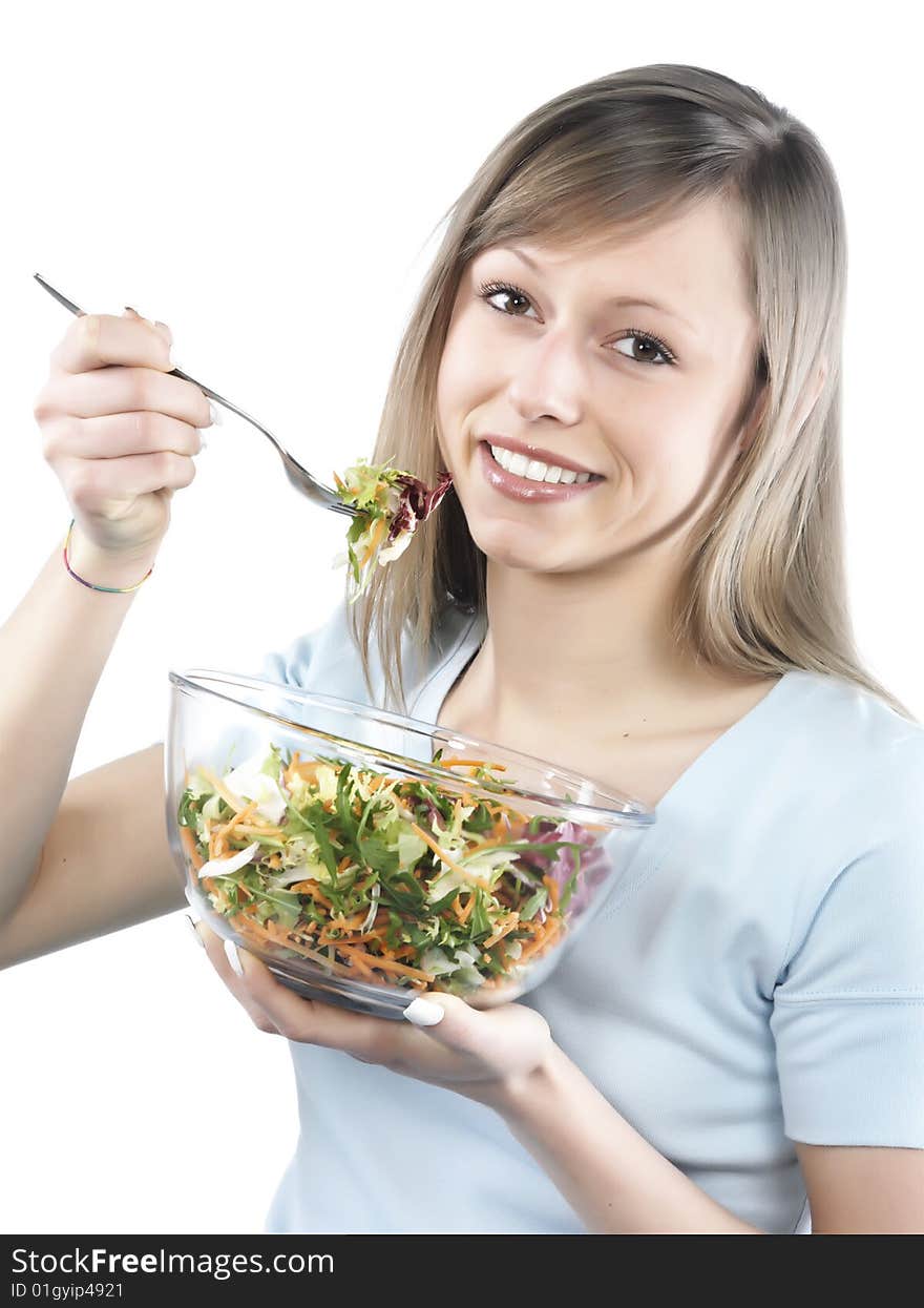 Portrait of young happy woman eating salad