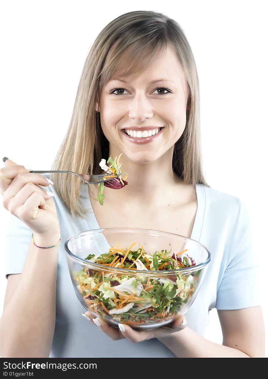 Portrait of young happy woman eating salad