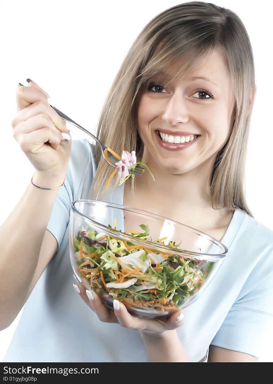 Portrait of young happy woman eating salad