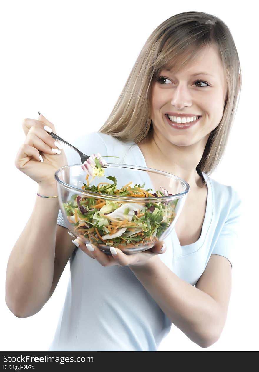 Portrait of young happy woman eating salad