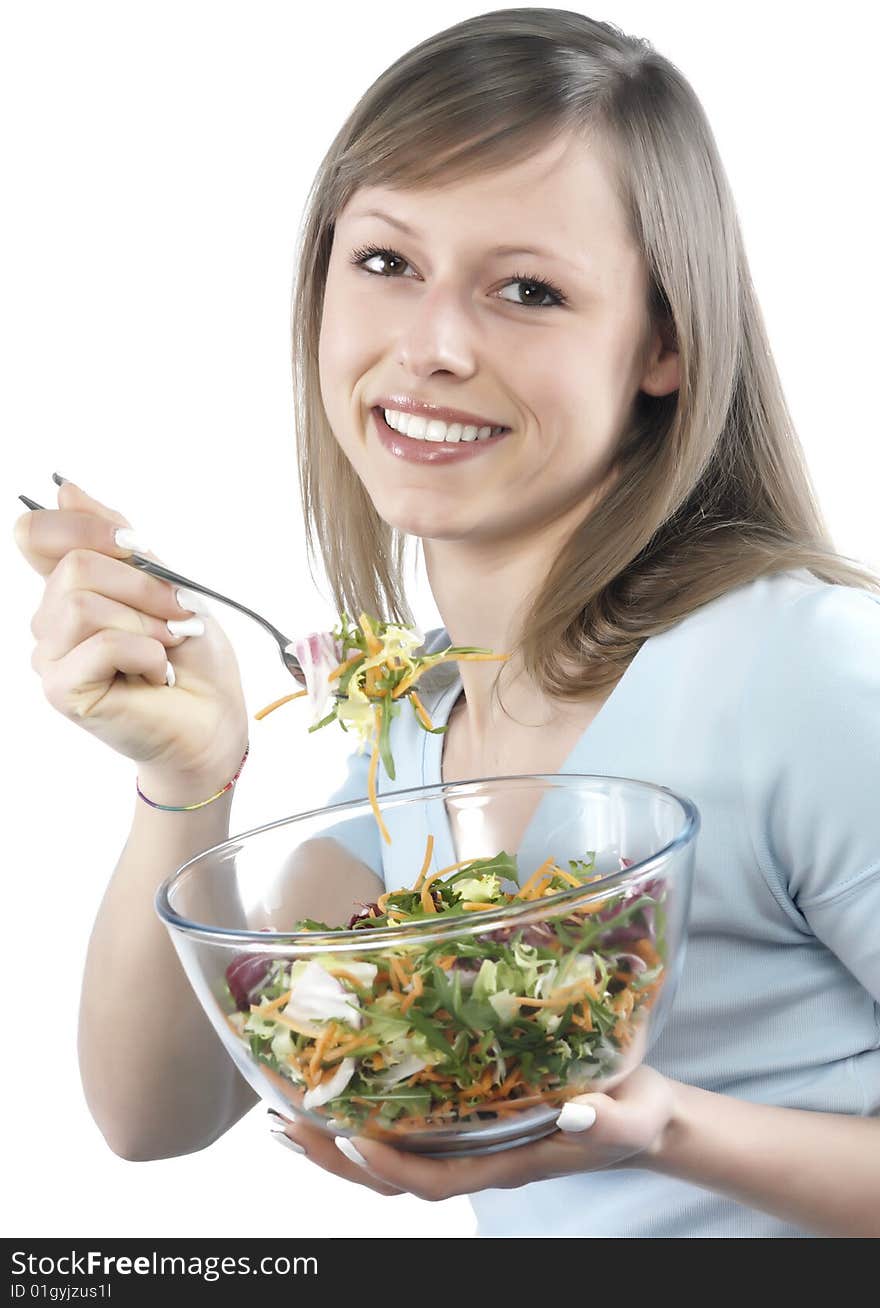 Portrait of young happy woman eating salad