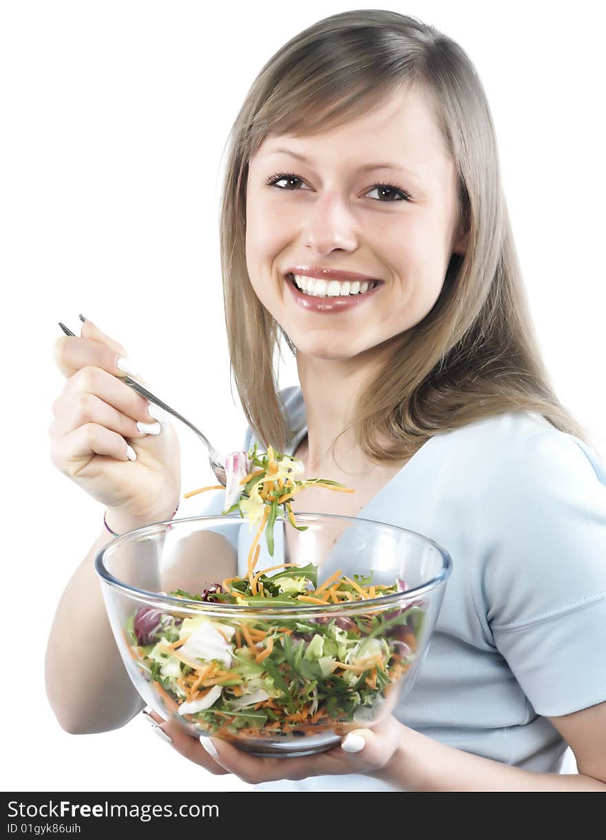 Portrait of young happy woman eating salad