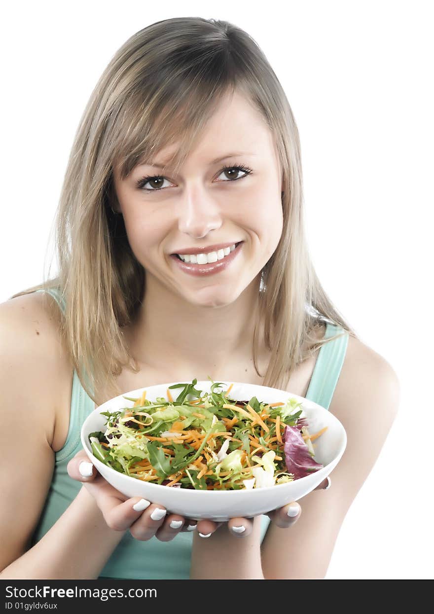 Portrait of young happy woman eating salad