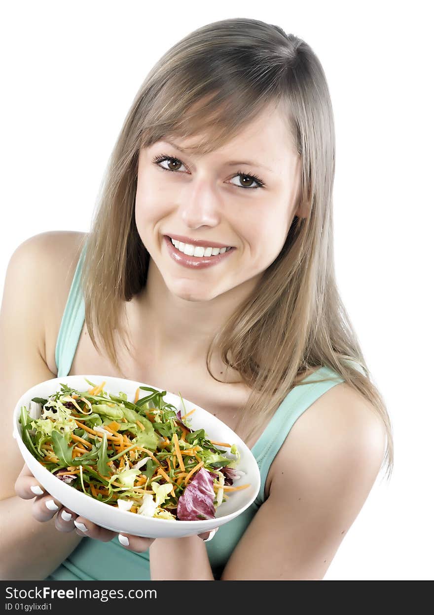 Portrait of young happy woman eating salad