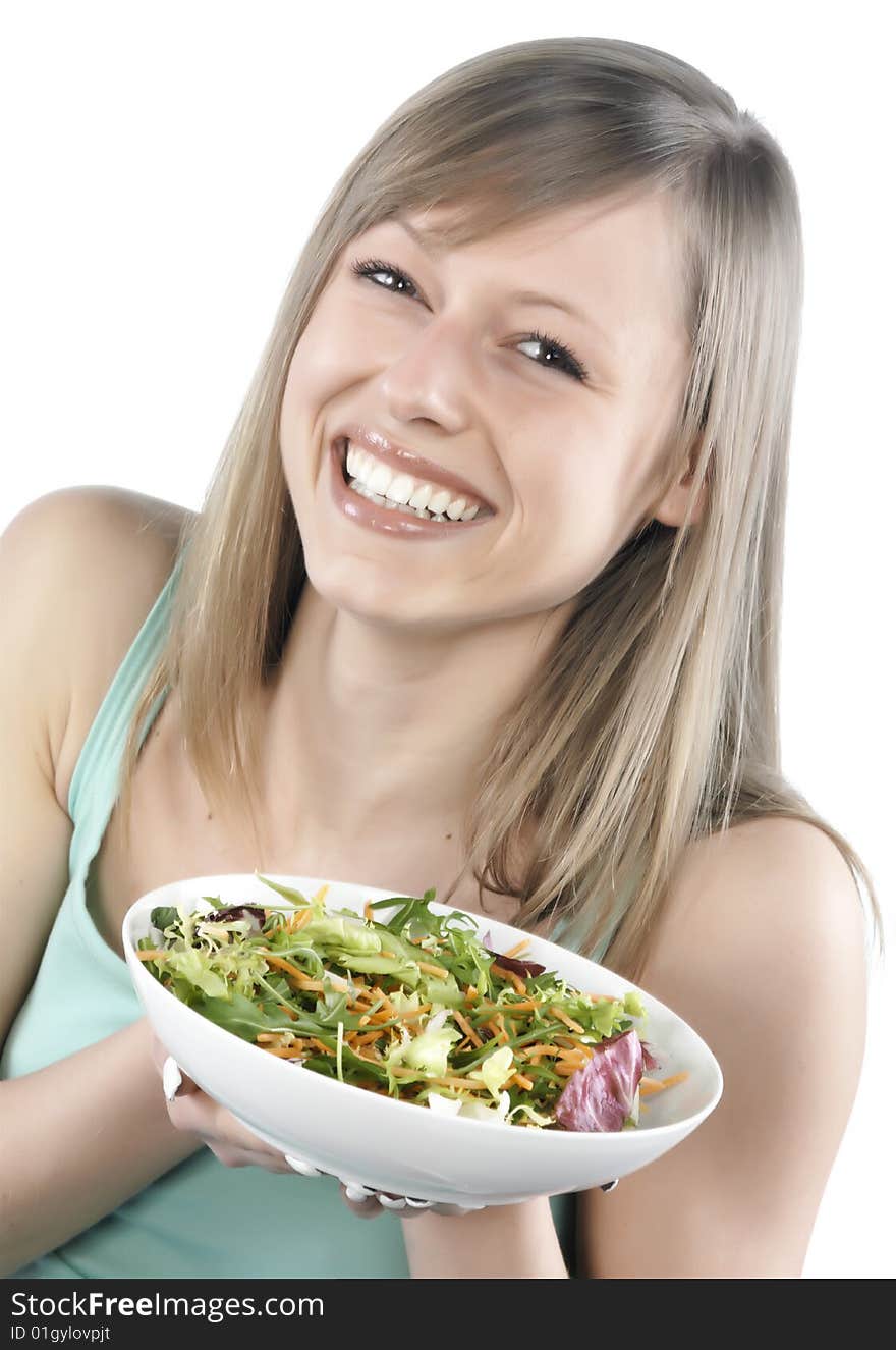 Portrait of young happy woman eating salad