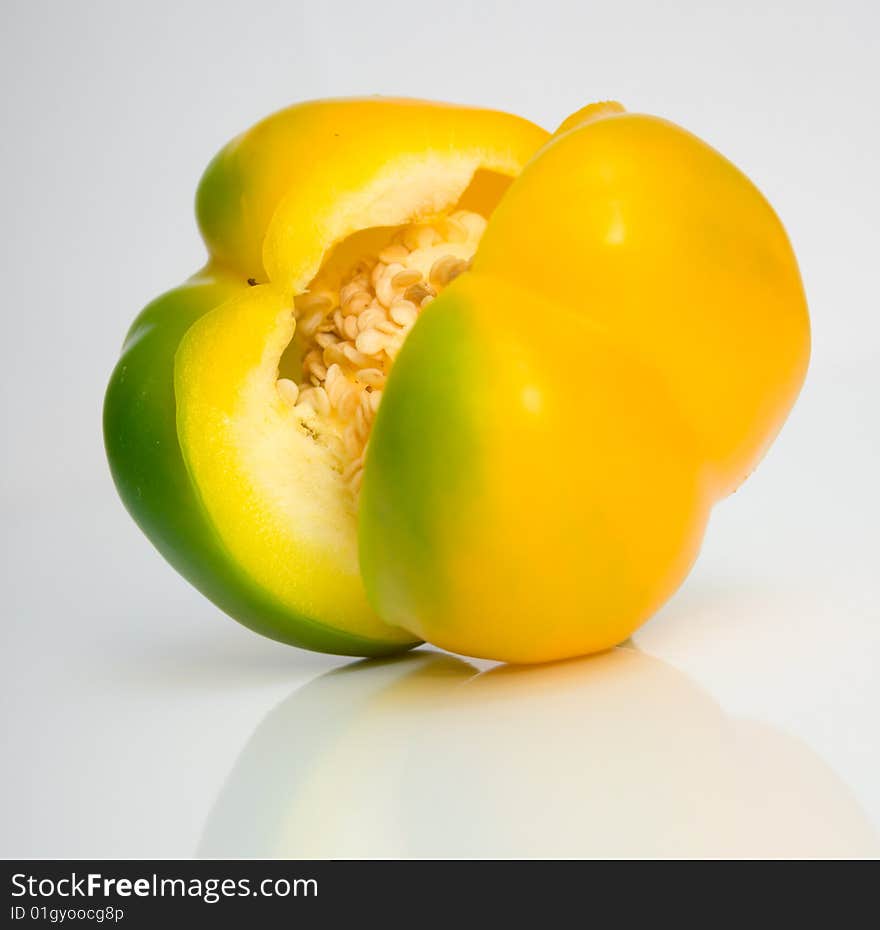 The Bulgarian pepper close up on white surface. The Bulgarian pepper close up on white surface