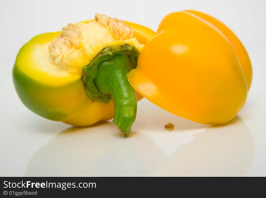 The Bulgarian pepper close up on white surface. The Bulgarian pepper close up on white surface