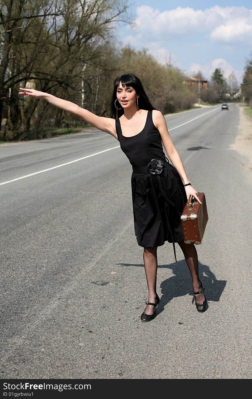 Girl with vintage suitcase outdoors. Girl with vintage suitcase outdoors