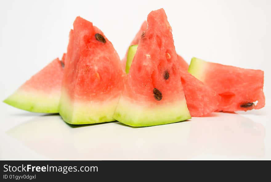 Juicy watermelon on a white surface. Juicy watermelon on a white surface