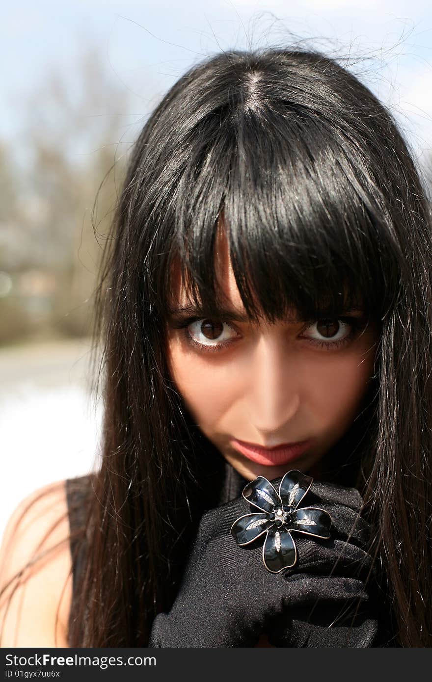 Brunette with ring as black flower