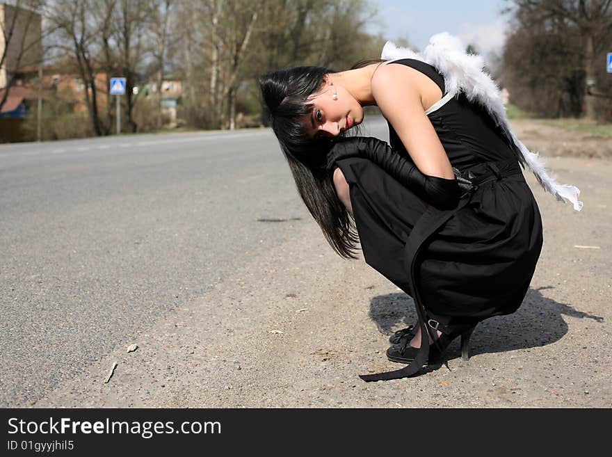 Sad white angel at road outdoors. Sad white angel at road outdoors