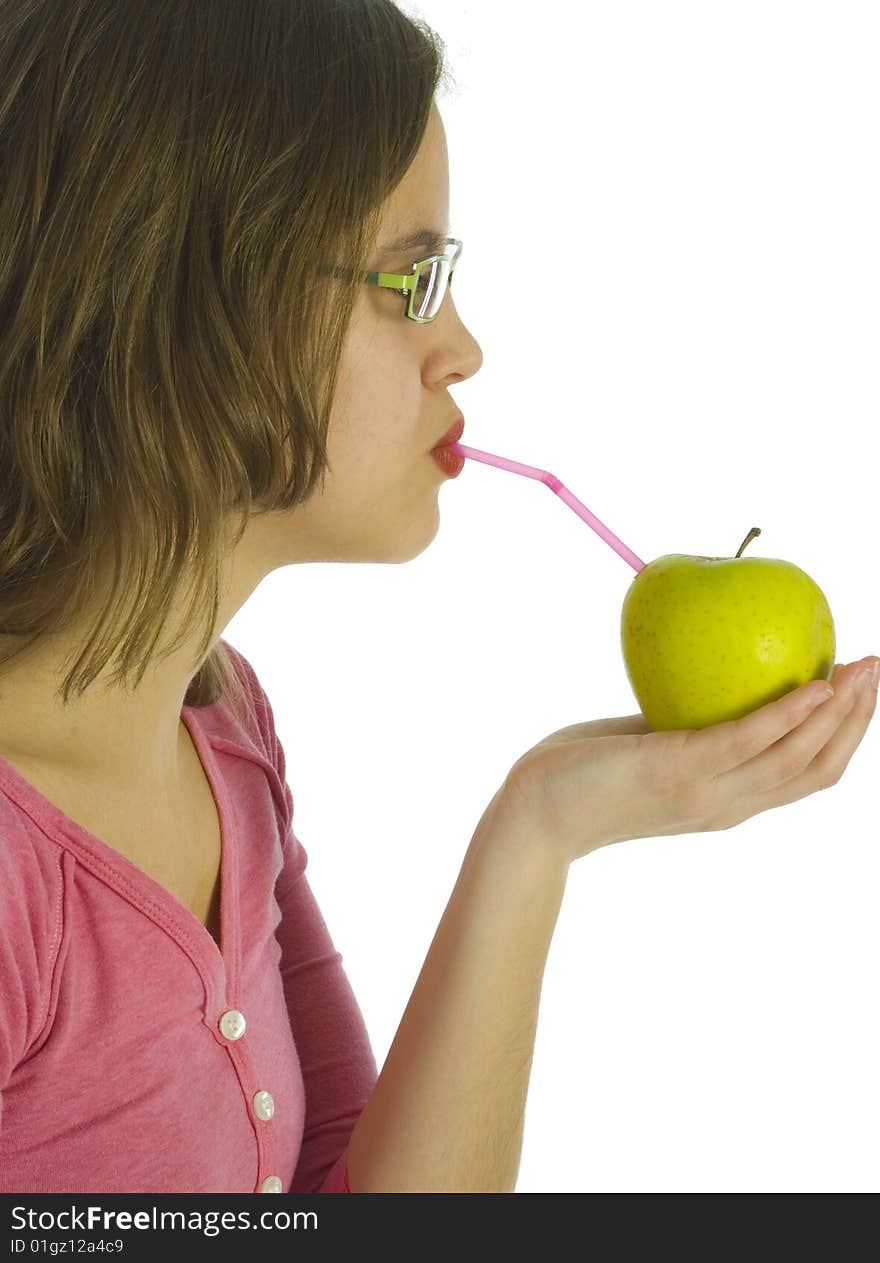 Nice girl drinking direct from the fruit