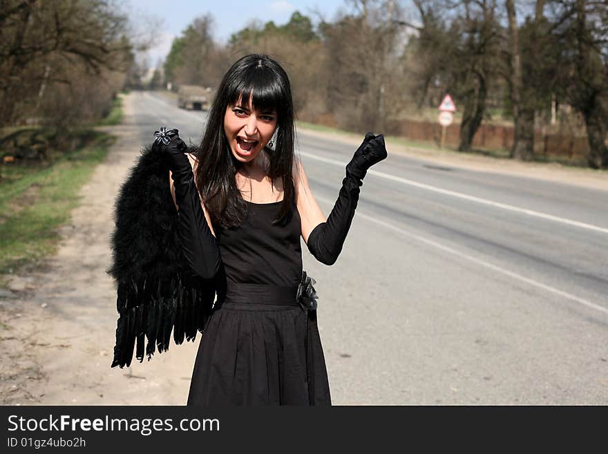 Black angel at the road. Black angel at the road