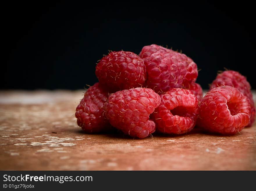 Raspberries on Pink Slate