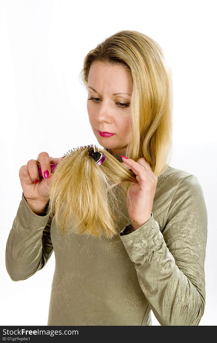 Long hair blonde woman with hairbrush in her hand. Long hair blonde woman with hairbrush in her hand