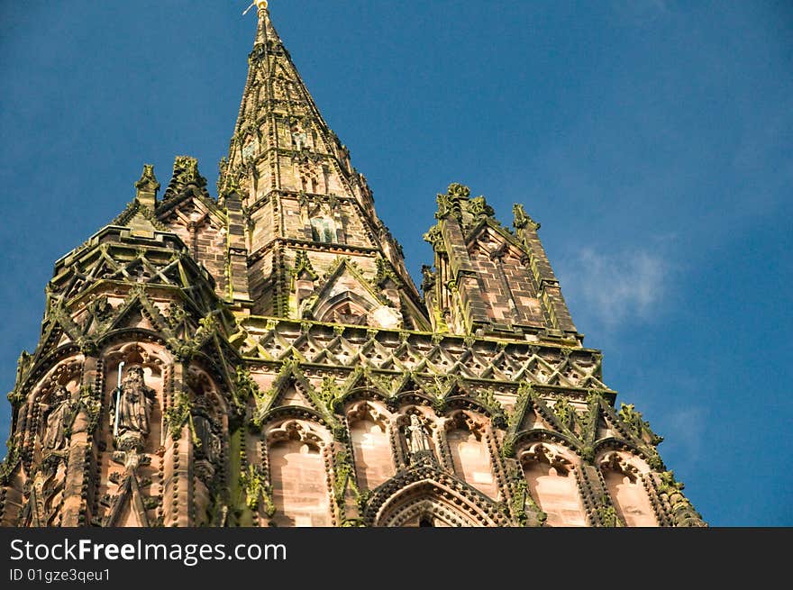 The spire of lichfield cathedral and its carvings. The spire of lichfield cathedral and its carvings