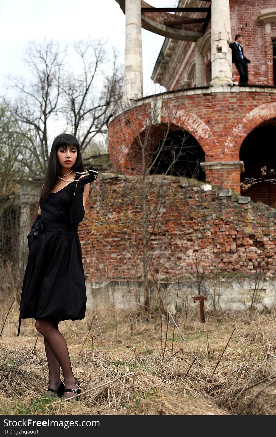 Girl and man beside vintage house. Girl and man beside vintage house