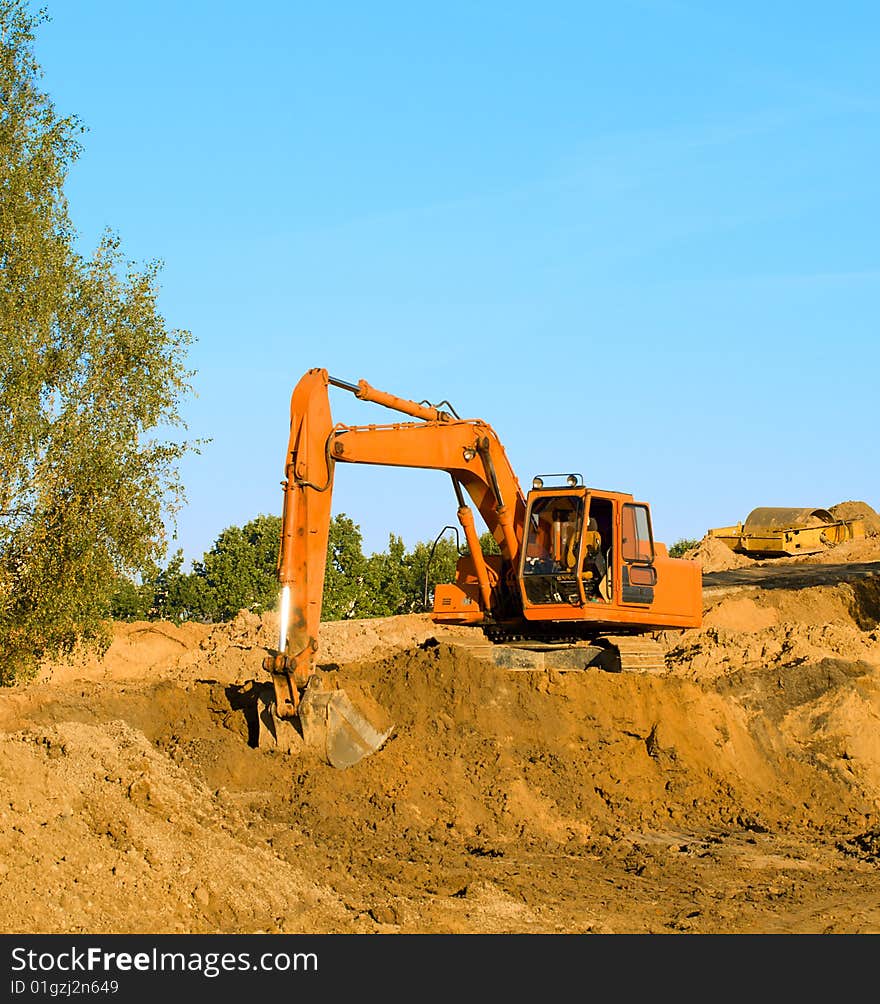 Excavator on gravel