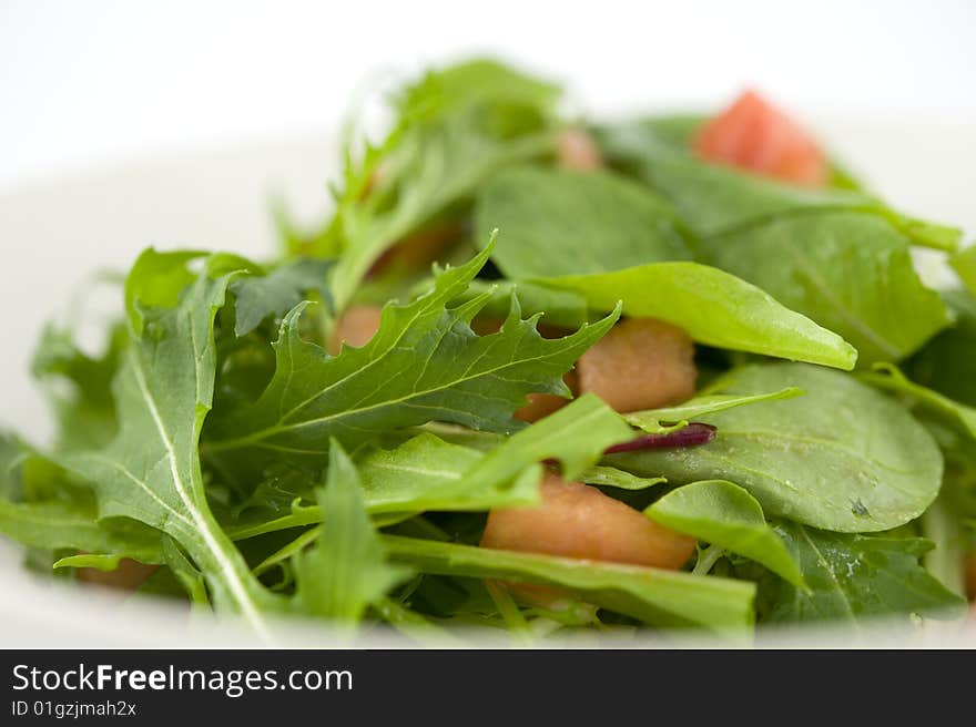 Baby leaf salad with cube cut tomato. Baby leaf salad with cube cut tomato