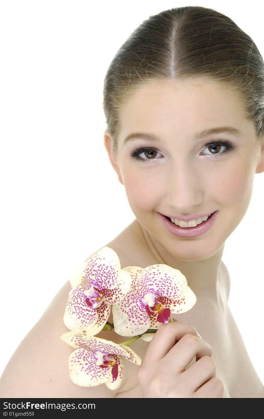 Beautiful girl holding orchid flower in her hands. Beautiful girl holding orchid flower in her hands