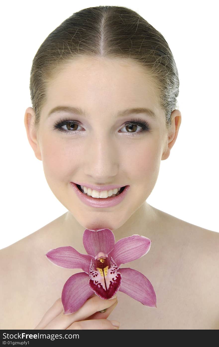 Beautiful girl holding orchid flower in her hands. Beautiful girl holding orchid flower in her hands