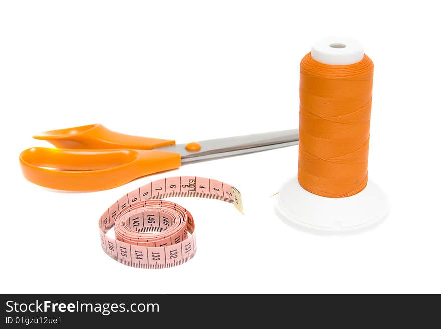 Tape measure and shears on white background