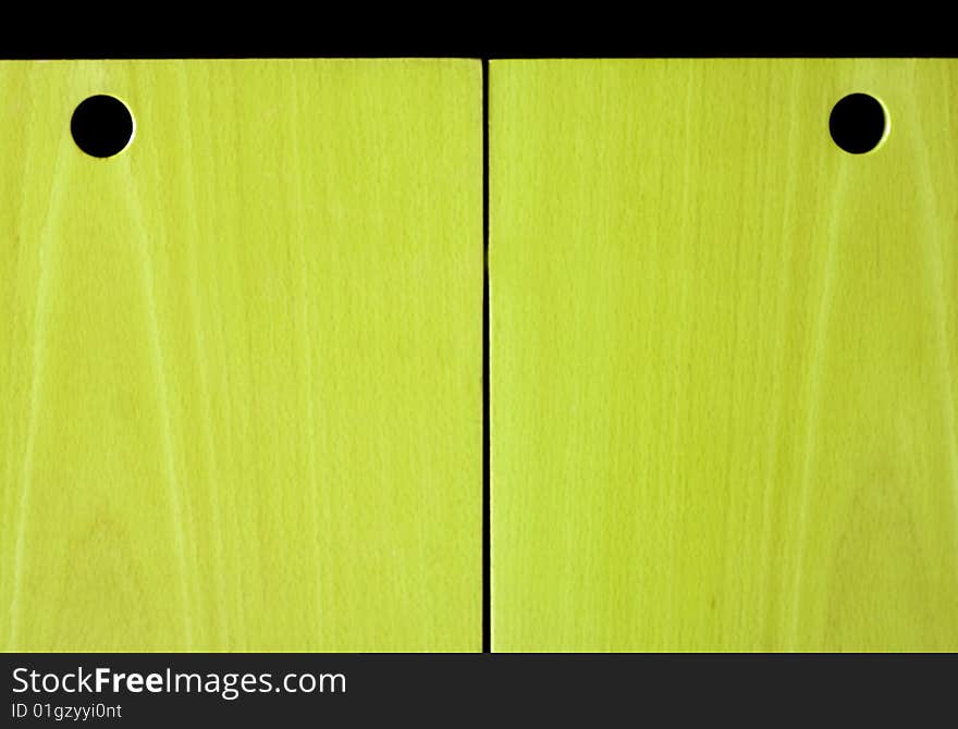 Colored wooden panel with holes