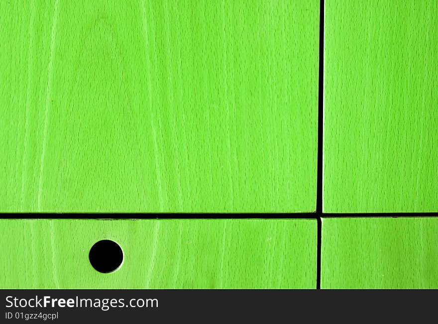 Colored wooden panel with holes