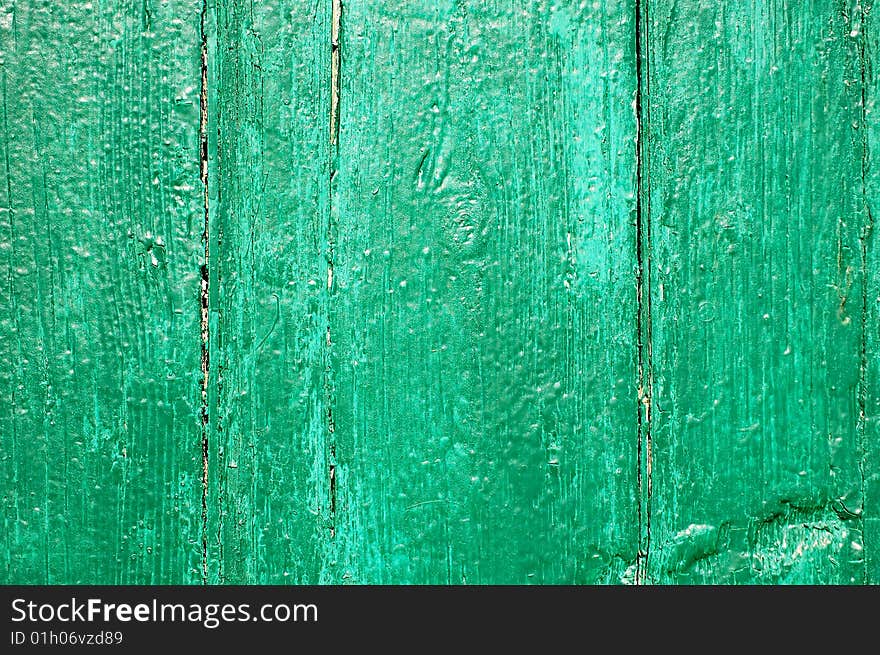 Green painted cracked wooden plank. Green painted cracked wooden plank