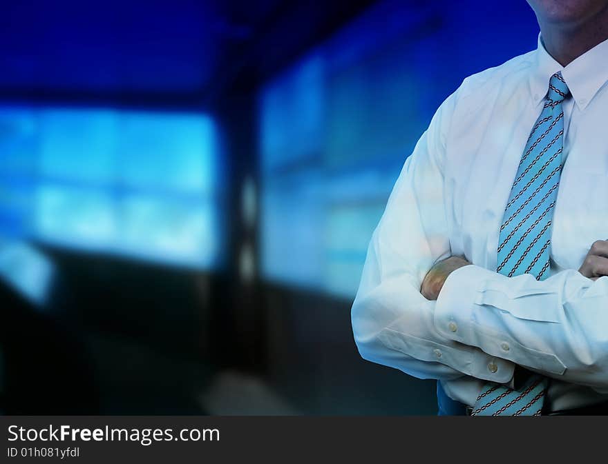 Businessman with modern office in background. Businessman with modern office in background