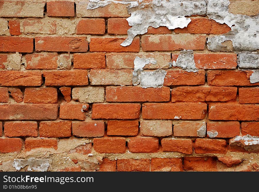 Fragment of tumbledown red brick wall. Fragment of tumbledown red brick wall