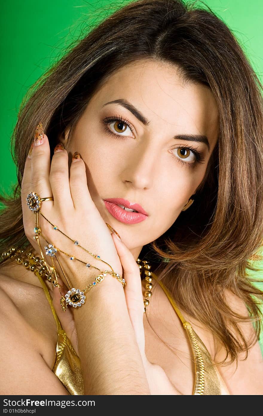 Beautiful woman with golden beads