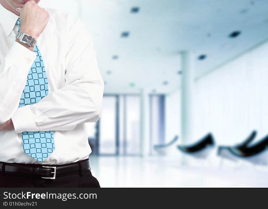 Businessman with modern office in background. Businessman with modern office in background