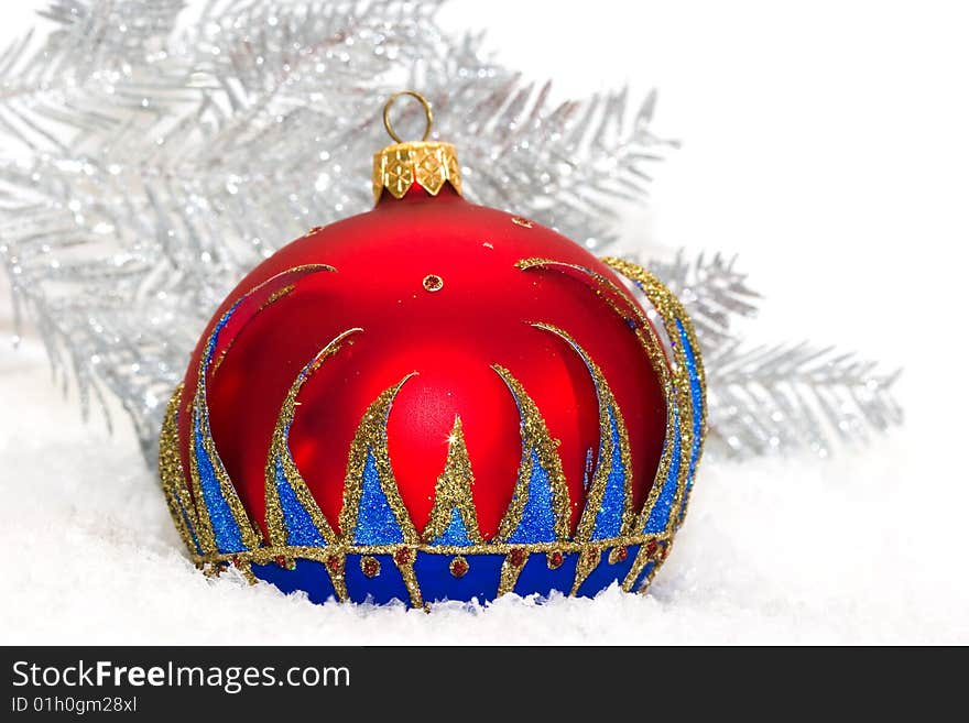 Red Christmas ball and winter tree