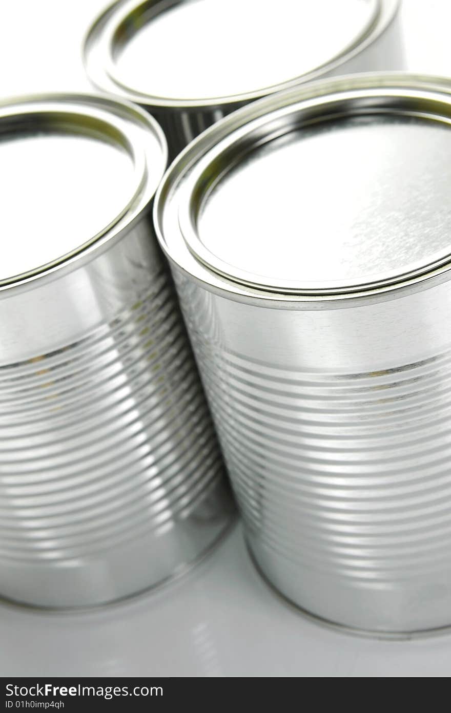 Tin canisters isolated against a white background