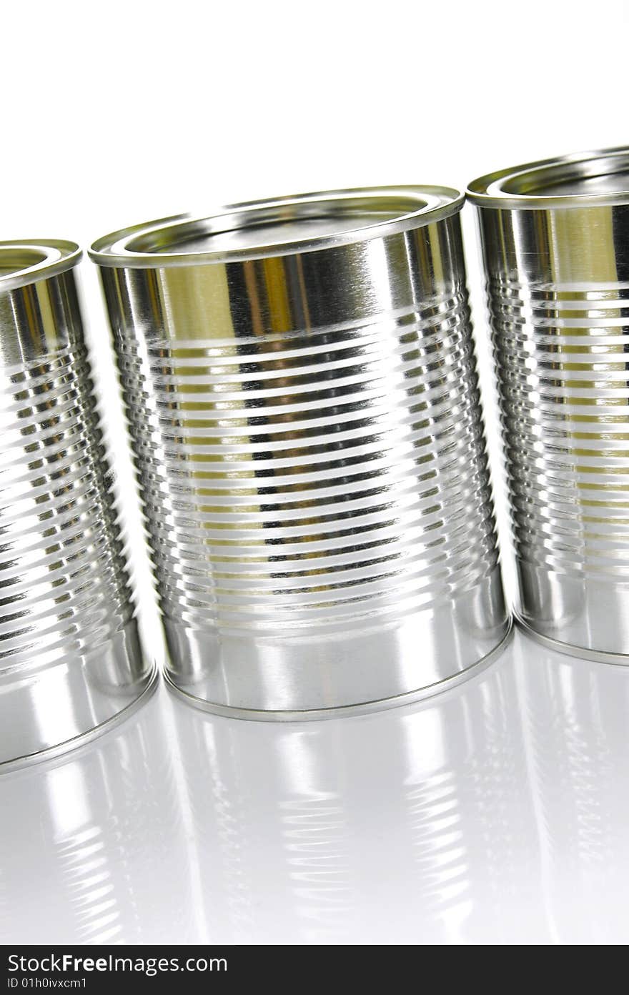 Tin canisters isolated against a white background