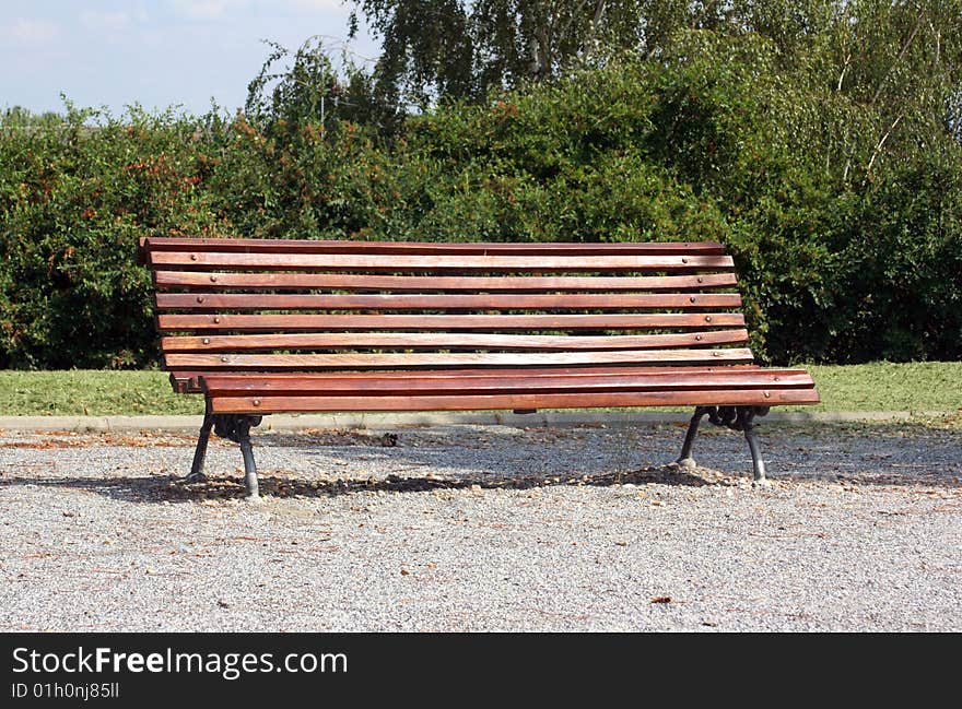 Wooden bench for resting in a garden