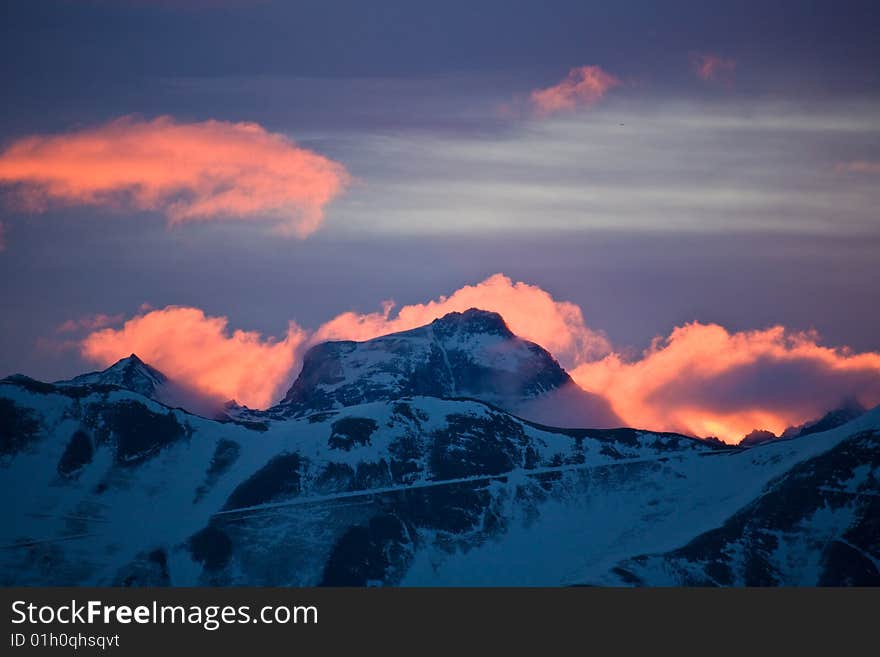 Against the morning sun the mountain seems to burn. Against the morning sun the mountain seems to burn.