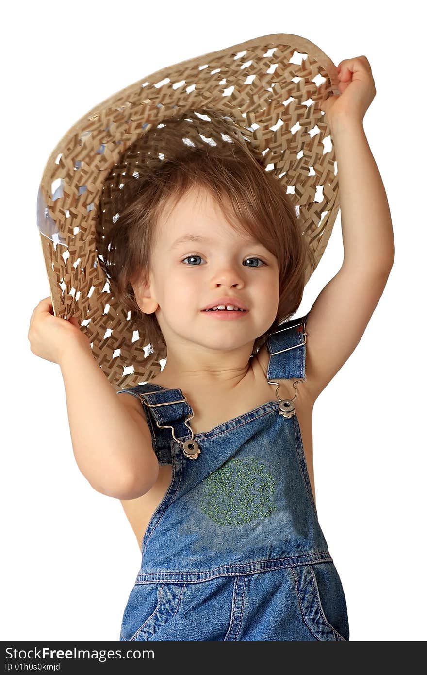 A little girl is in a straw hat. A little girl is in a straw hat.