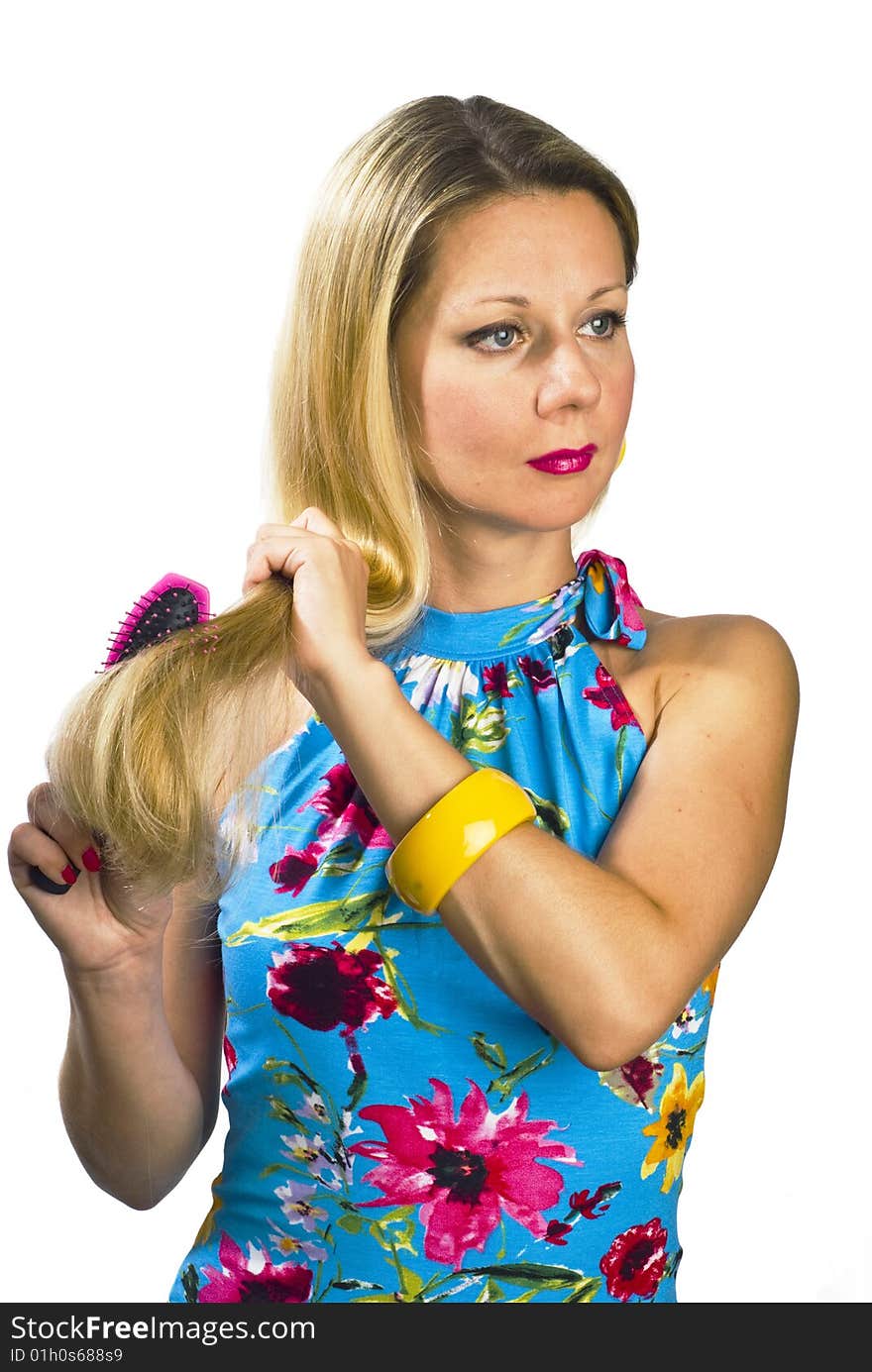 Long hair blonde woman with hairbrush in her hand. Long hair blonde woman with hairbrush in her hand