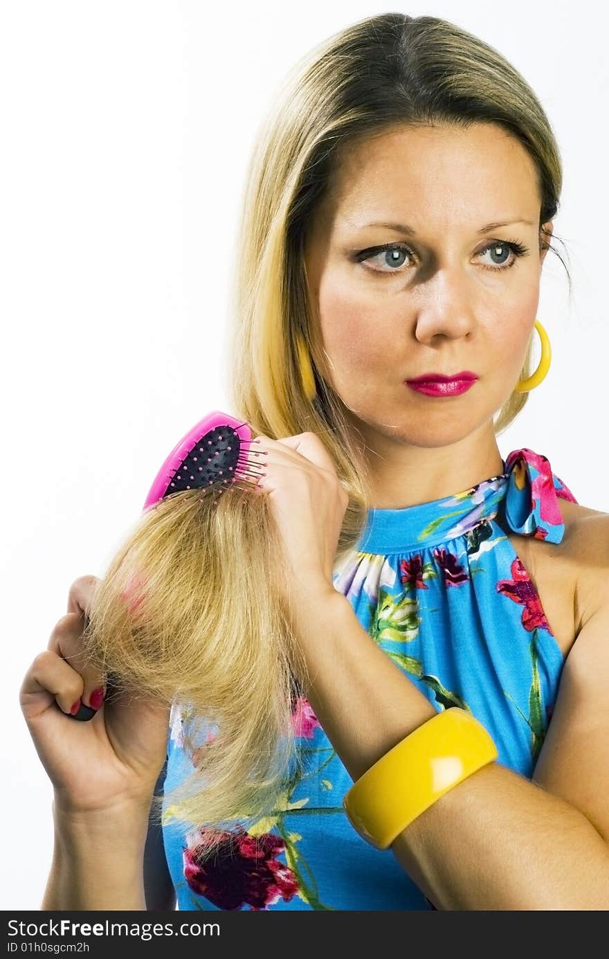 Long hair blonde woman with hairbrush in her hand. Long hair blonde woman with hairbrush in her hand