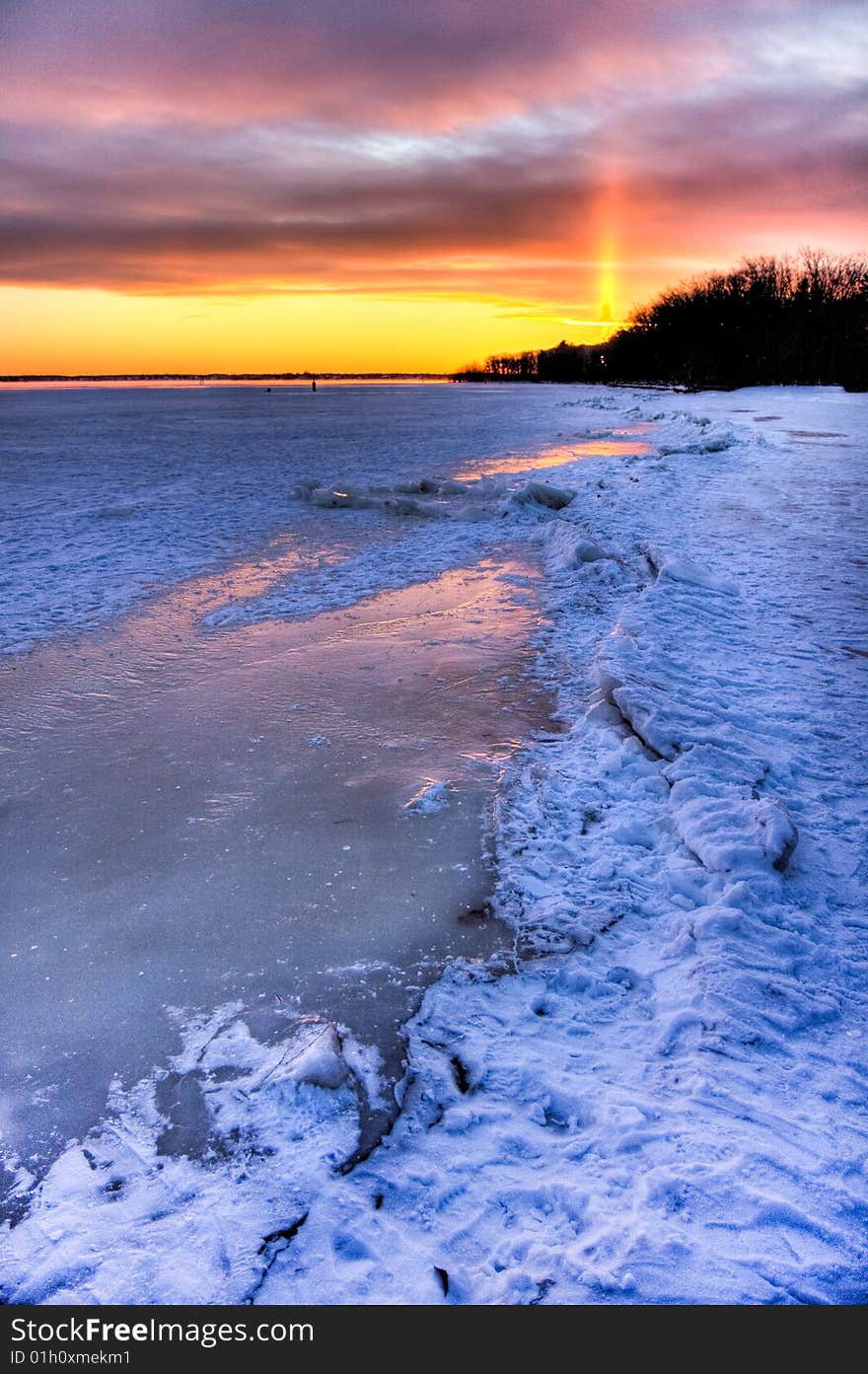 Sunset over a frozen lake.