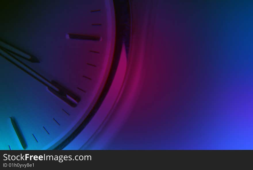 Watch face overlaid with blue and purple lighting. Watch face overlaid with blue and purple lighting