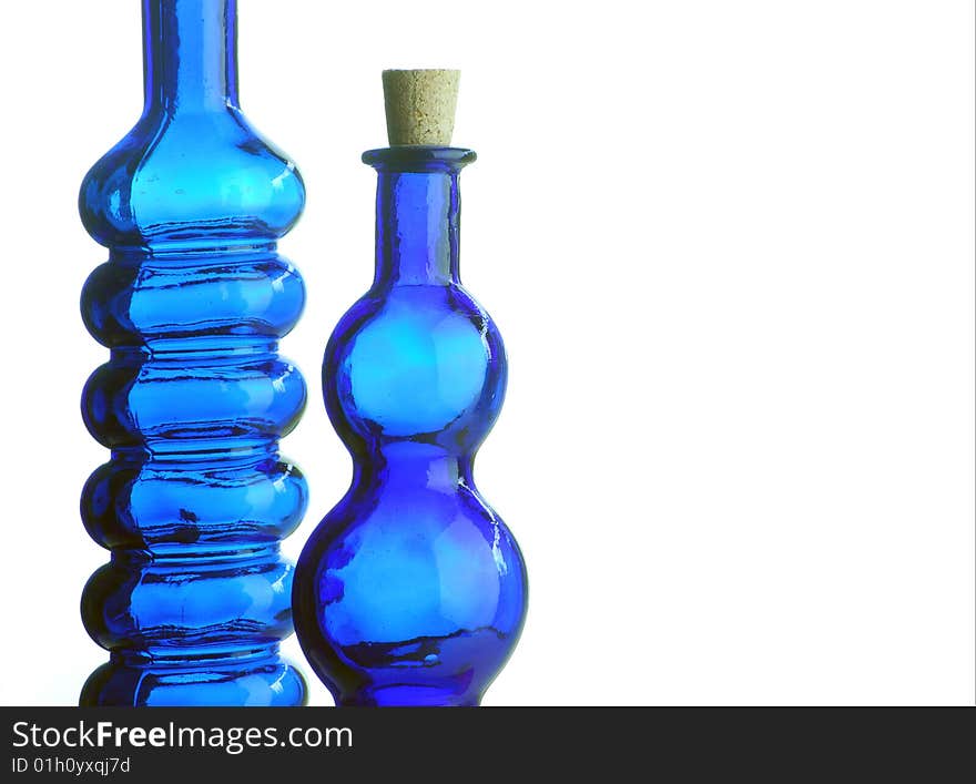 Two decorative blue bottles on white background