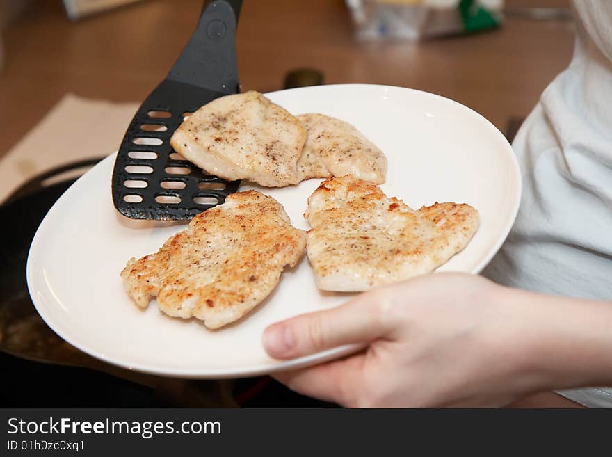 Chicken cutlets on a plate, shallow DOF