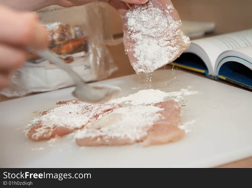 Dredging meat in flour, shallow DOF, close-up