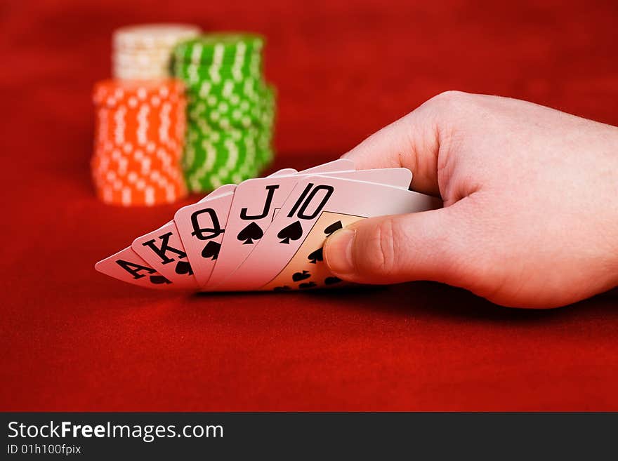 Hand keeping row of cards, another view